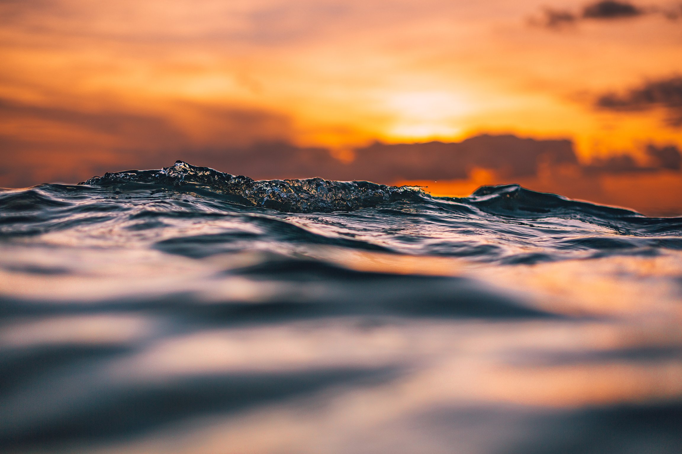 Water Waves Under Beautiful Orange Sky