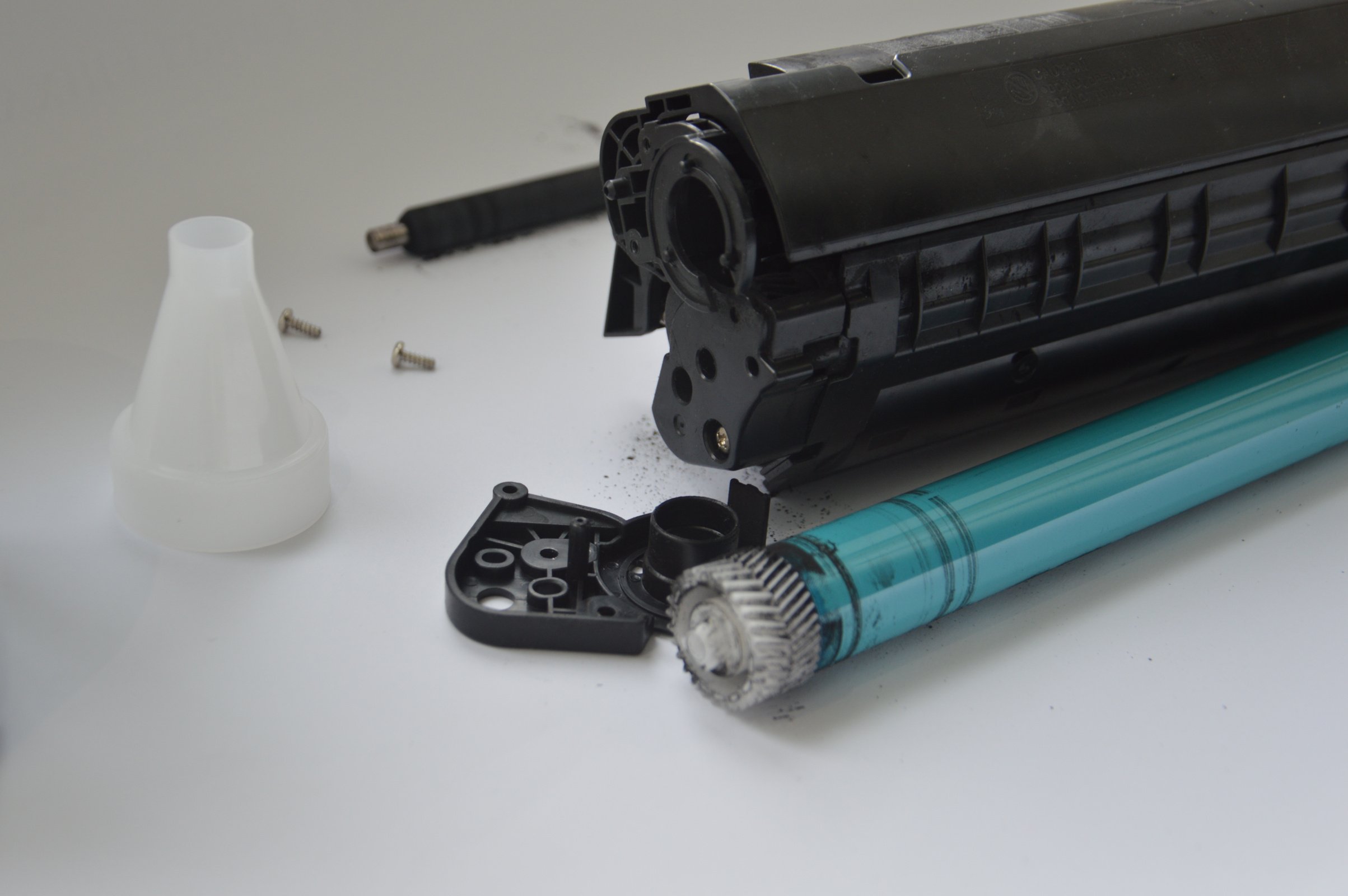 Charging the laser printer cartridge with toner powder